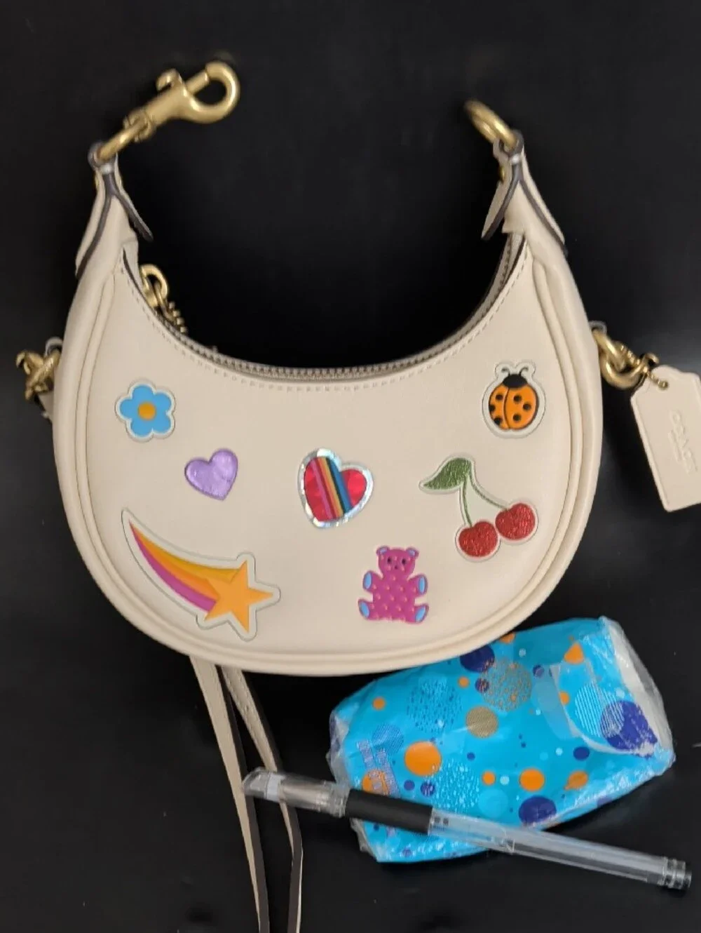 Cream Mini Crescent Crossbody Bag with Playful Patch Motifs